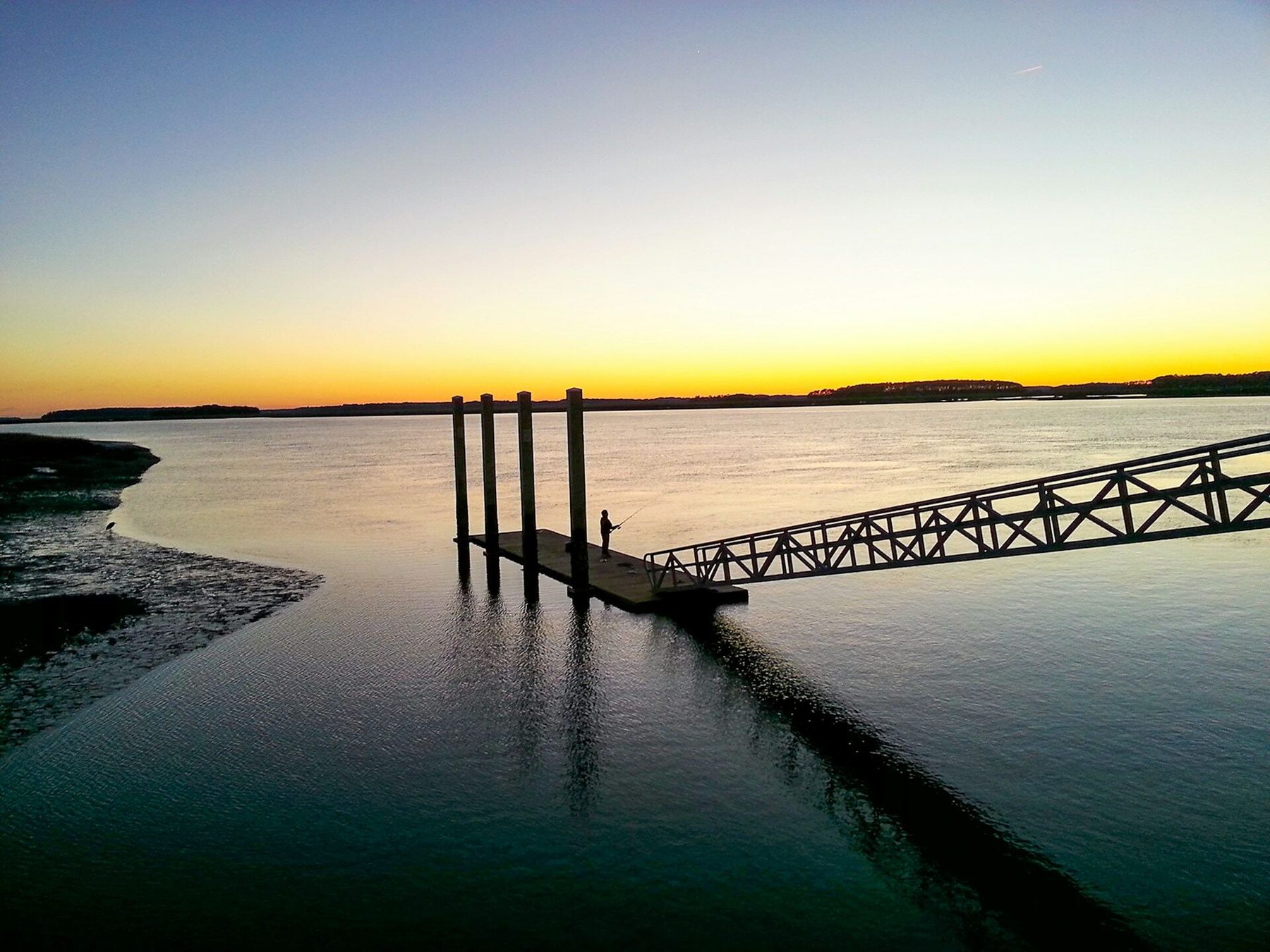 A dock at sunset on a Lowcountry tidal river