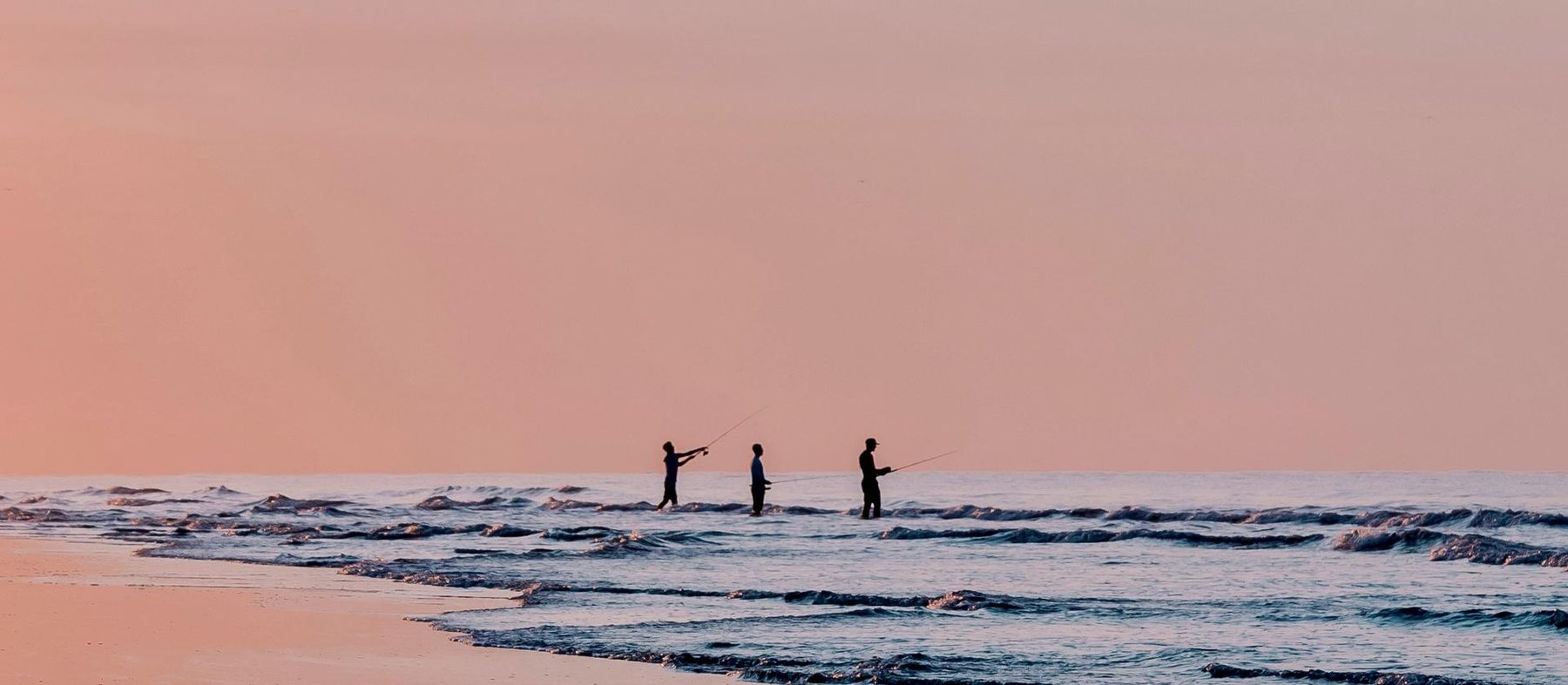 Surf fishing at dusk on Sullivan's Island